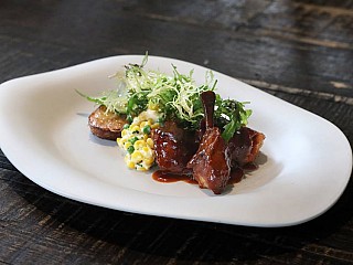 BBQ spring chicken, sweet corn ragout, potato fondant, mustard frill salad