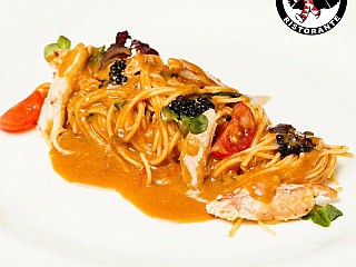Angel Hair Pasta Served with Crab Meat and Cooked in ‘Bisque’ Sauce
