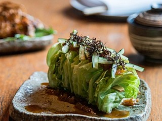 Iceberg lettuce, crispy konbu, pickled cucumber, and wafu dressing