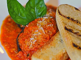 stuffed aubergine with mixed minced meat in a rich aromatic basil and tomato sauce
