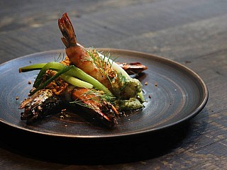 Roasted king prawns, garden herb gremolata, compressed spring onions