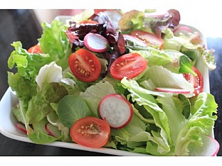 Green salad with honey baked ham, egg and spicy Thai chili dressing