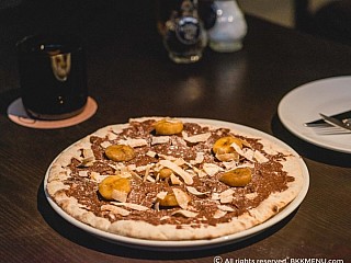 Nutella Pizza Topped with Shredded Coconut and Banana